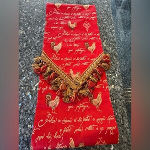Red jacquard table runner featuring a traditional French rooster design 104x12”